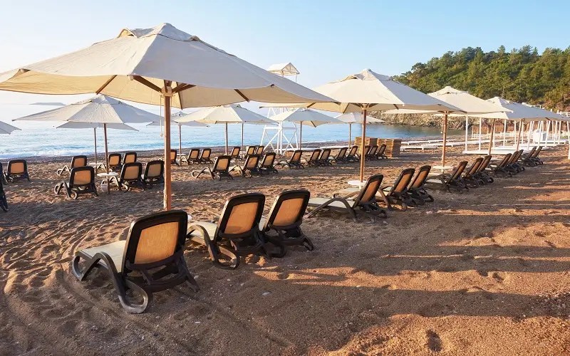 scenic-view-private-sandy-beach-with-sun-beds-from-sea-mountains-amara-dols-vita-luxury-hotel-resort-tekirova-kemer-turkey